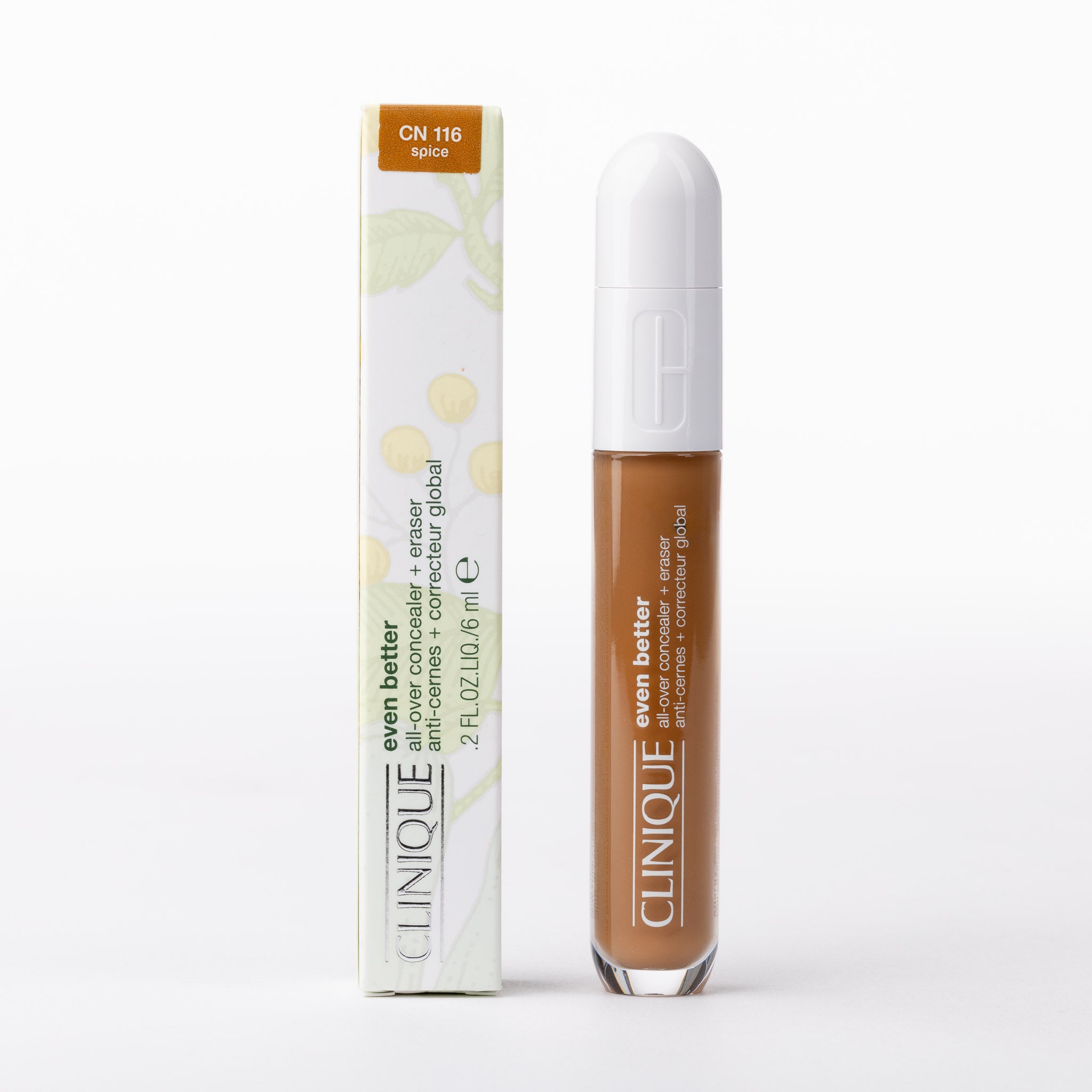 Clinique Even Better All-Over Concealer + Eraser, CN 116 Spice. Rich brown liquid in tube, white botanical box.