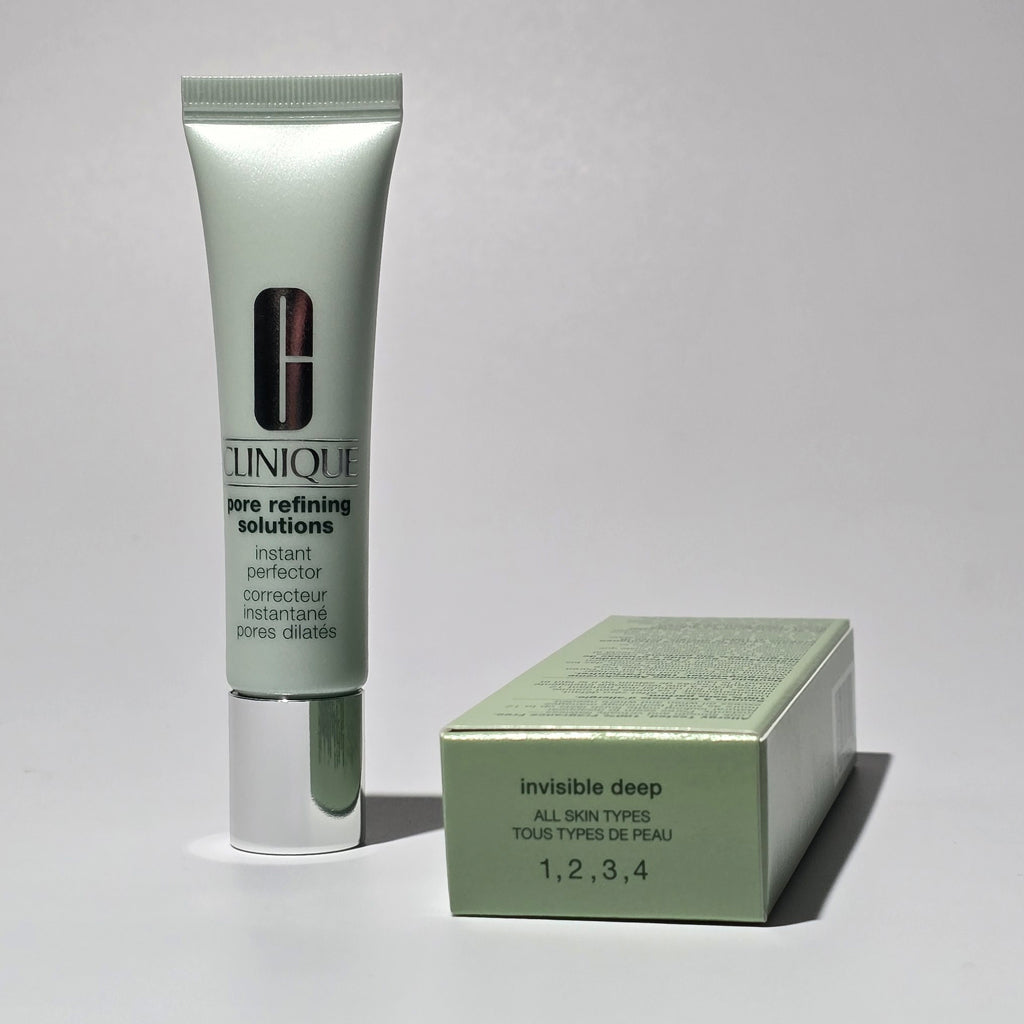 Clinique skincare product and packaging on a gray background