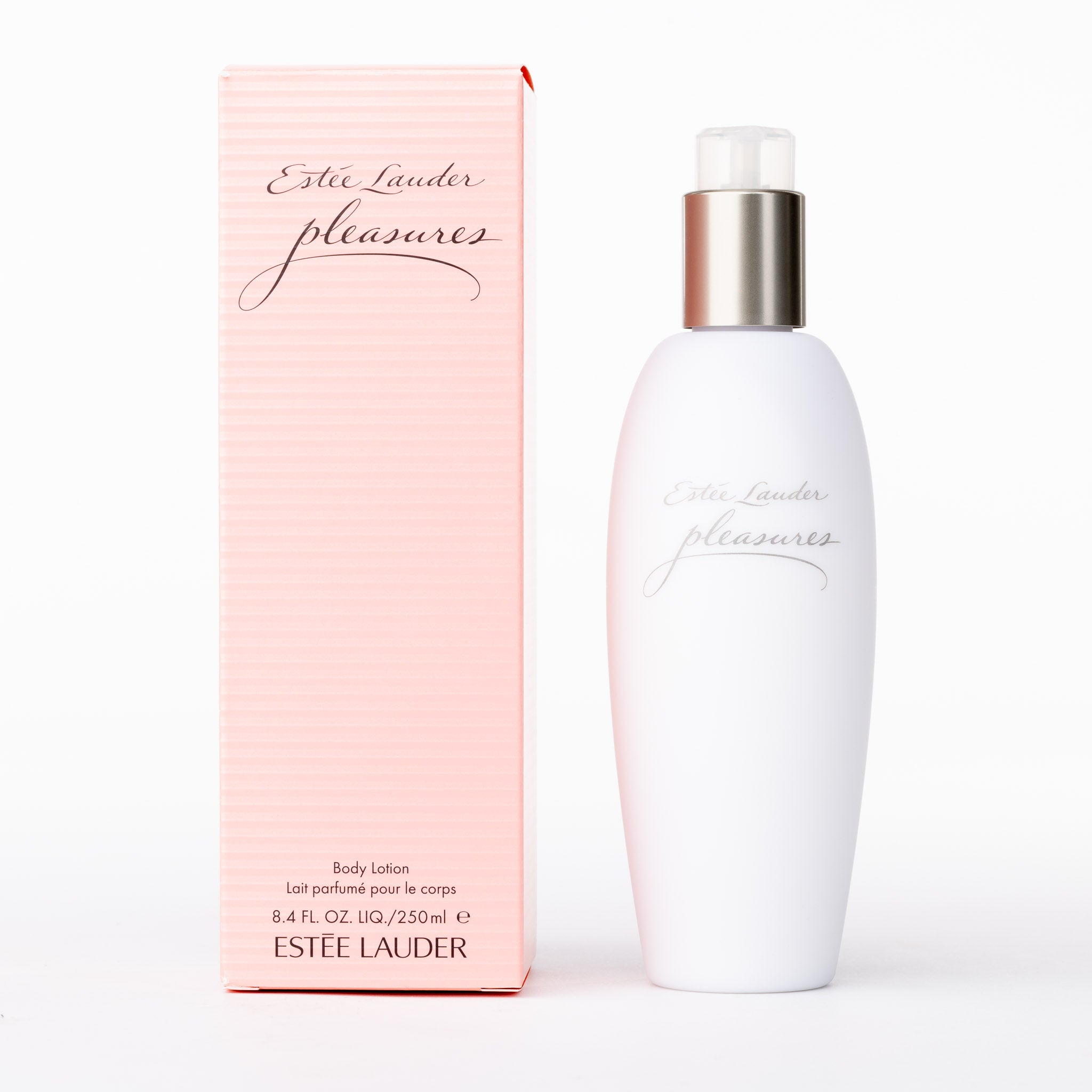 Estée Lauder Pleasures Body Lotion. Luxurious body moisturiser in pink striped box & sleek white bottle with silver cap.