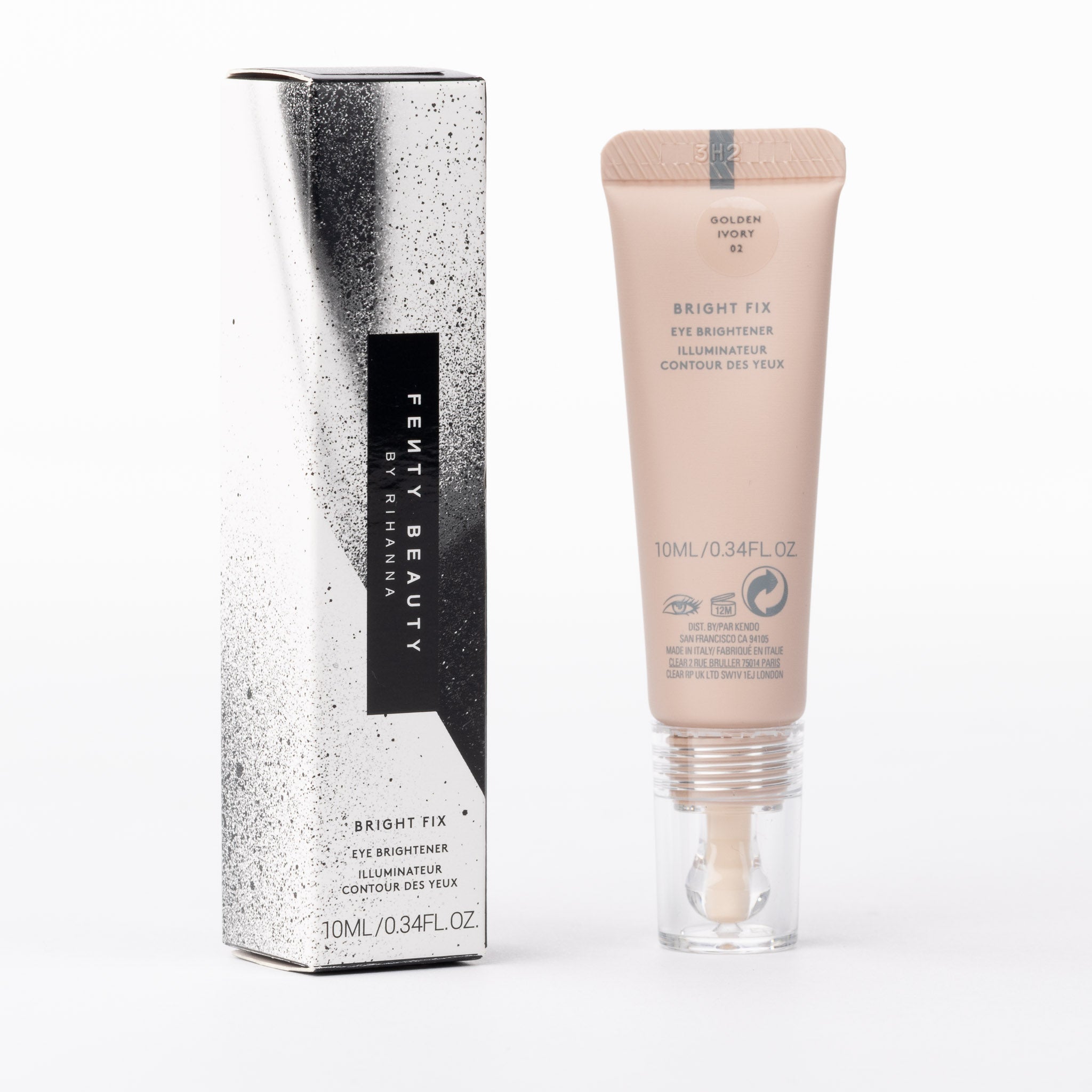 Fenty Beauty Bright Fix Eye Brightener, Golden Ivory 02. Nude-peach tube with wand applicator, metallic speckled box.