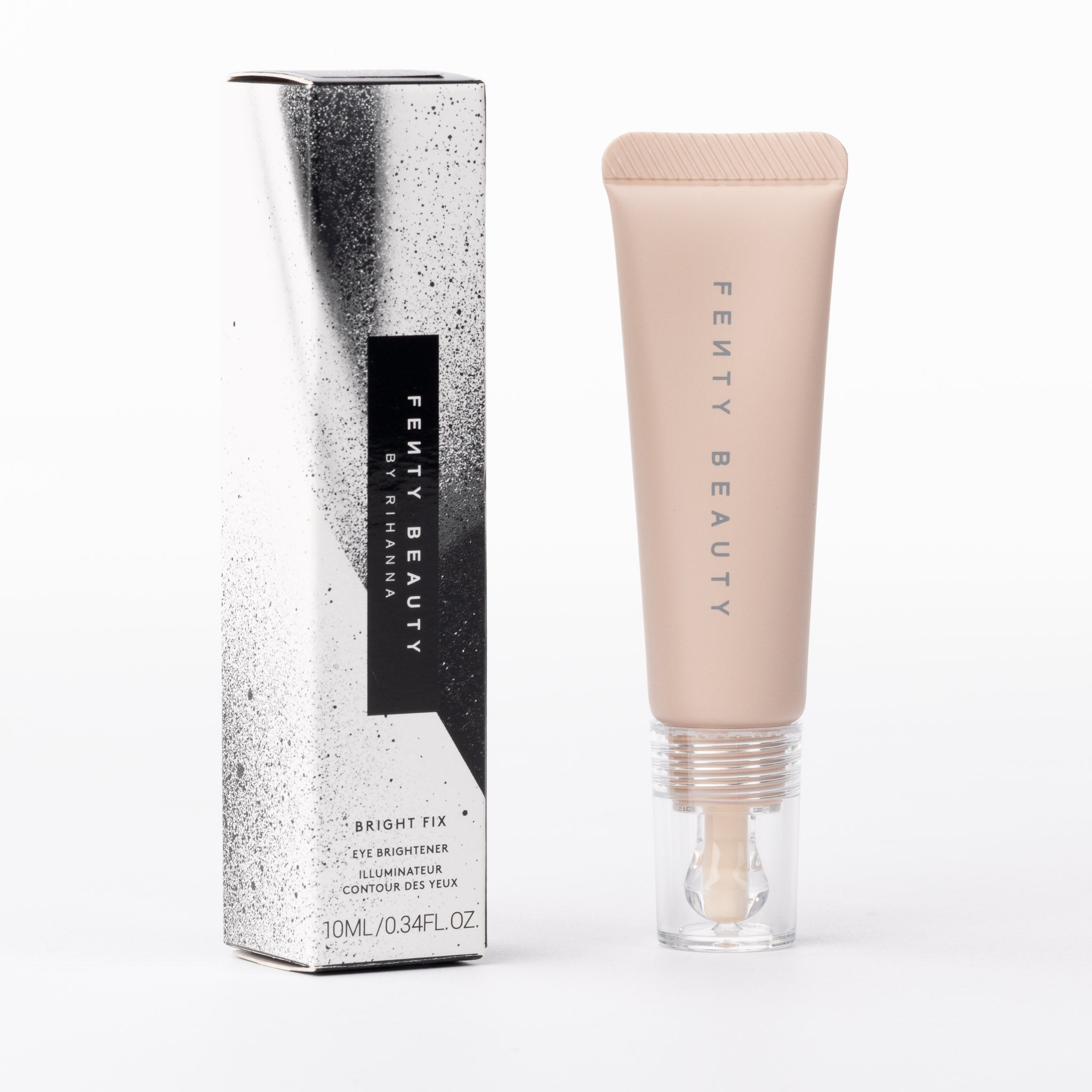 Fenty Beauty Bright Fix Eye Brightener. Light beige tube with clear applicator. White, silver & black speckled box.