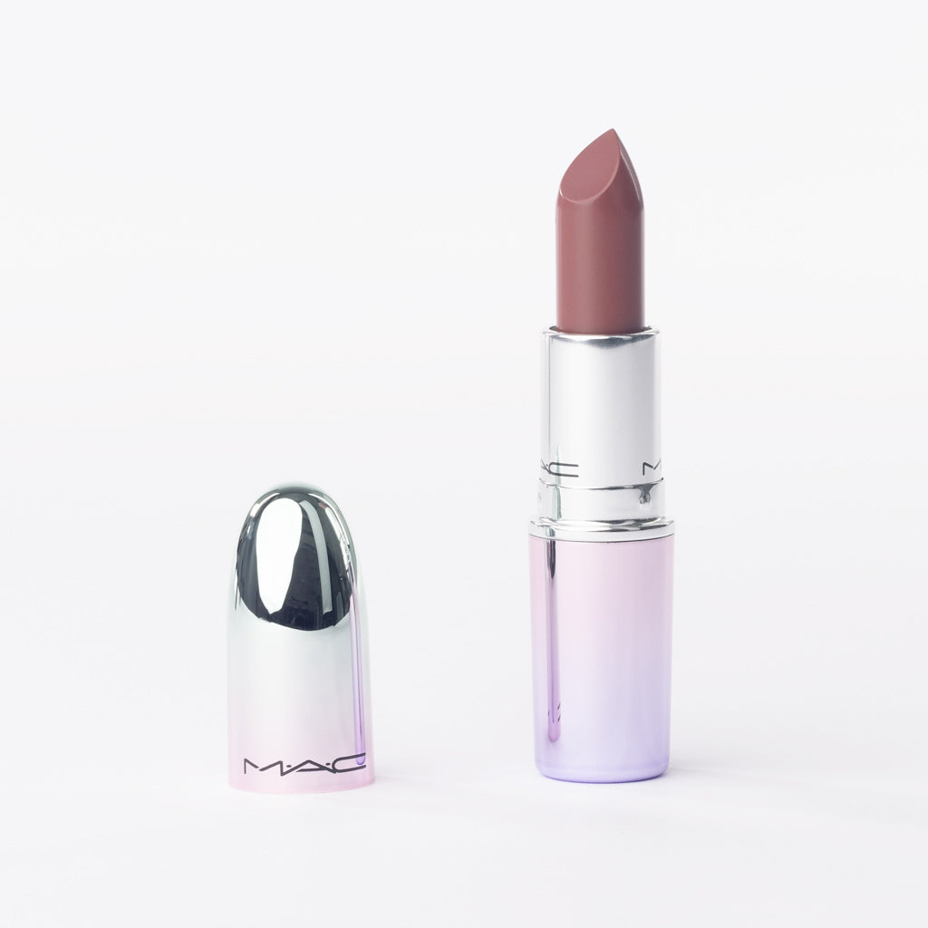 Lipstick with silver cap on a white background