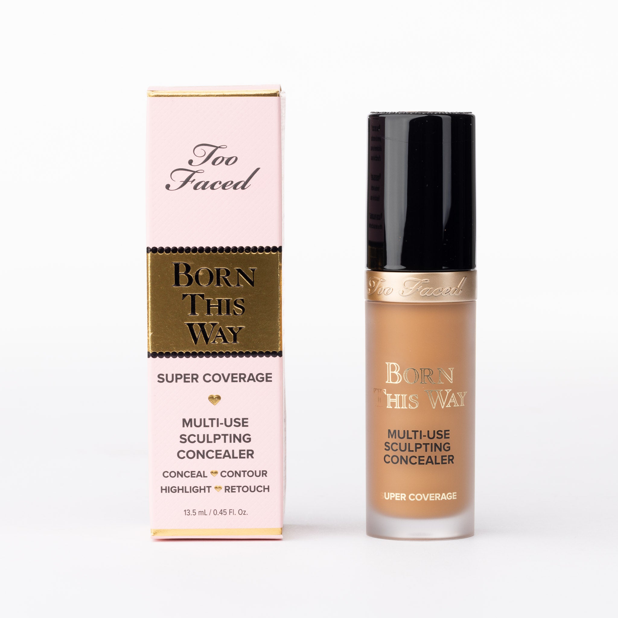 Too Faced Born This Way Super Coverage Multi-Use Sculpting Concealer in a warm tan shade, bottle with pink-gold box.