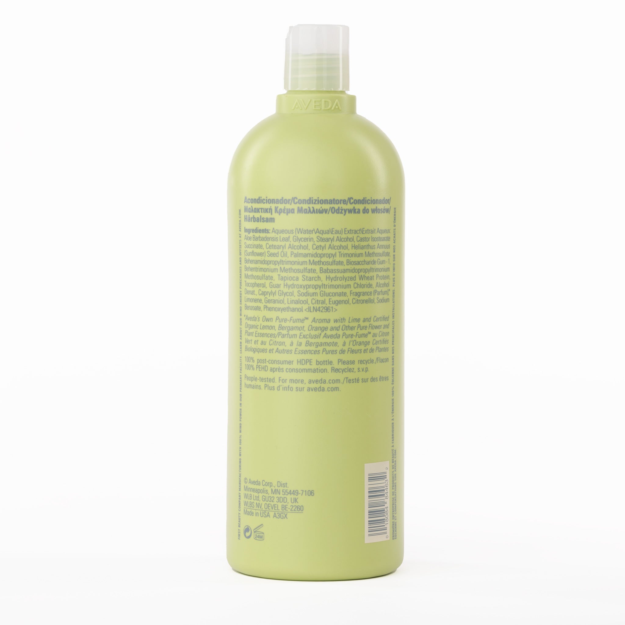 Green bottle of Aveda Be Curly Conditioner with label on a white background