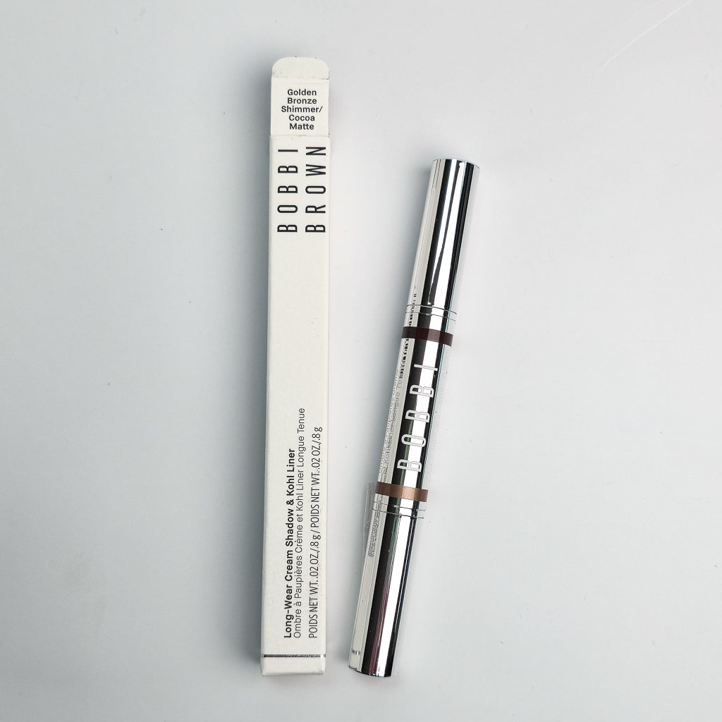 Dual-ended Bobbi Brown cream eyeshadow and kohl liner stick in bronze shimmer and cocoa matte