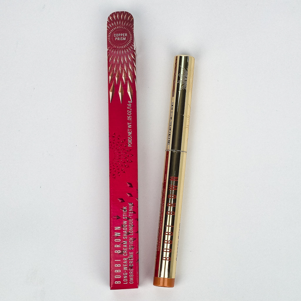 Bobbi Brown Cream Shadow Stick swatches in Bellini, Bronze Multi Chrome, Copper Prism, and Opal