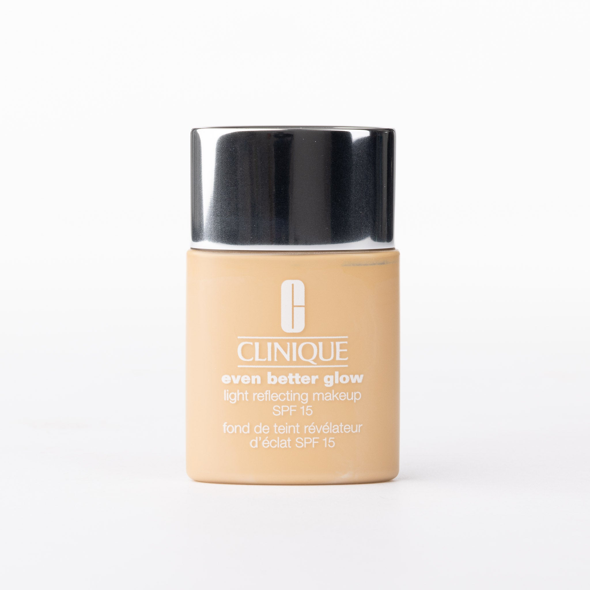 Clinique Even Better Glow Light Reflecting Makeup SPF 15 foundation. Warm beige liquid in a bottle with a silver cap.