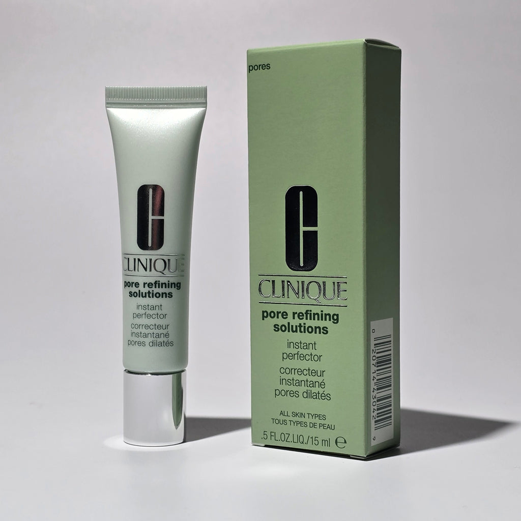 Clinique pore refining solution tube and box on a gray background