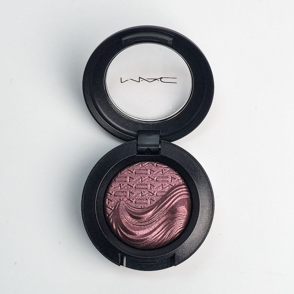 MAC Extra Dimension Eye Shadow open compact showing liquid-powder hybrid texture
