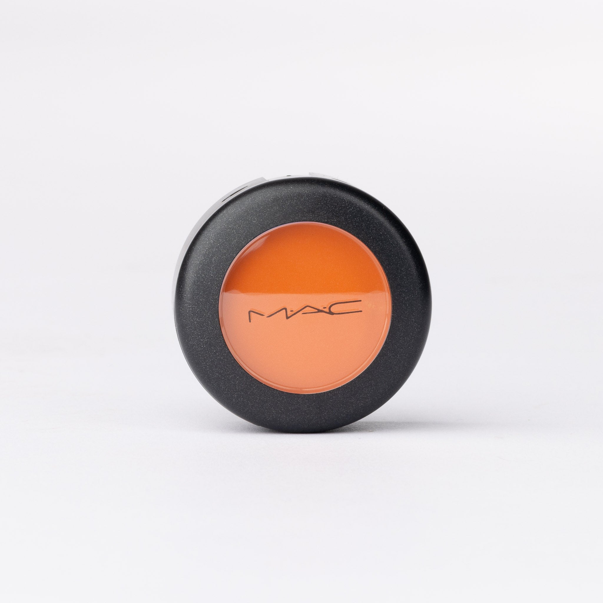 MAC Cosmetics luxury refill pan: vivid peachy orange matte powder eyeshadow or blusher.